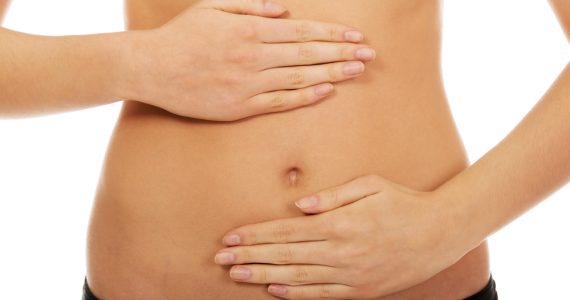 Close up of a woman's stomach to represent gut health