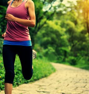 Close up of woman running in a park