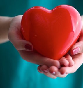 Woman holding a red heart