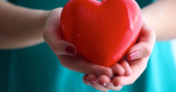 Woman holding a red heart