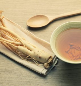 Close up of ginseng root and broth
