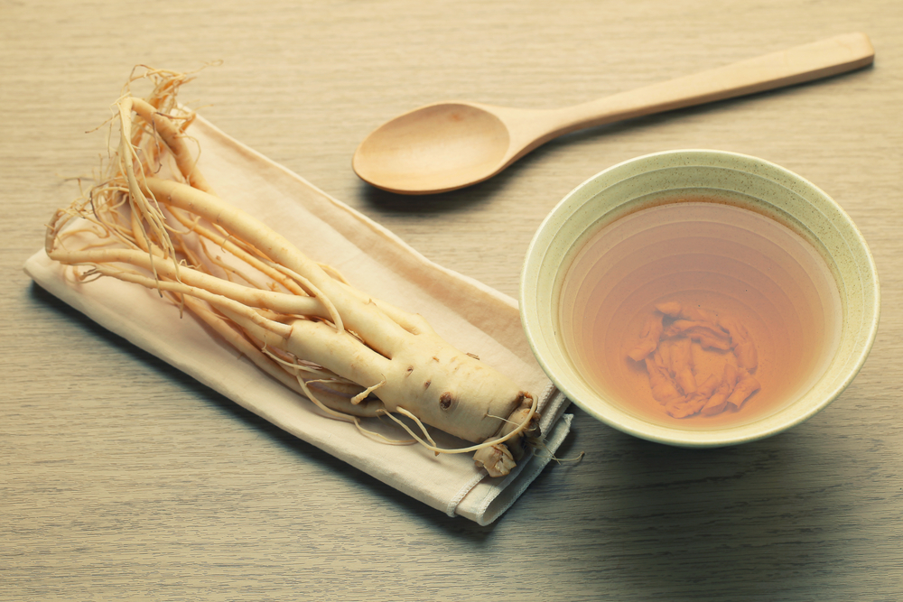Close up of ginseng root and broth