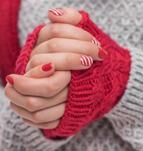 A woman with poor circulation and cold hands clasped together