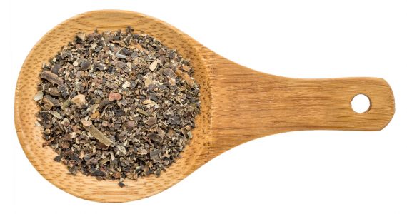 A wooden spoon containing dried bladderwrack