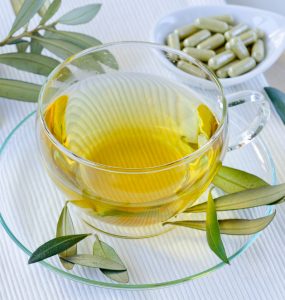 Olive leaf extract and olive leaves showing natural medicine