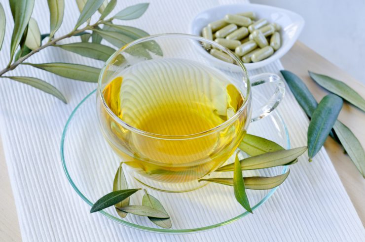 Olive leaf extract and olive leaves showing natural medicine