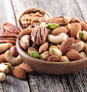A bowl containing a range of nuts