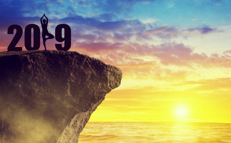 A woman doing Yoga forming the 'number one' of the New Year 2019