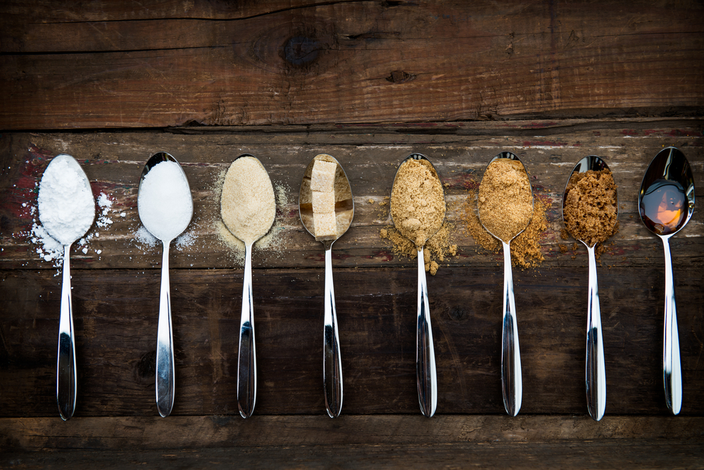 Different sugar sources on spoons