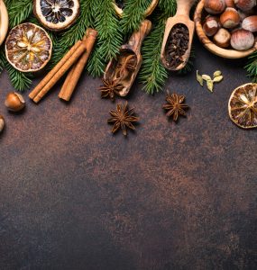 A range of christmas spices on a dark background