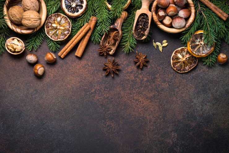 A range of christmas spices on a dark background