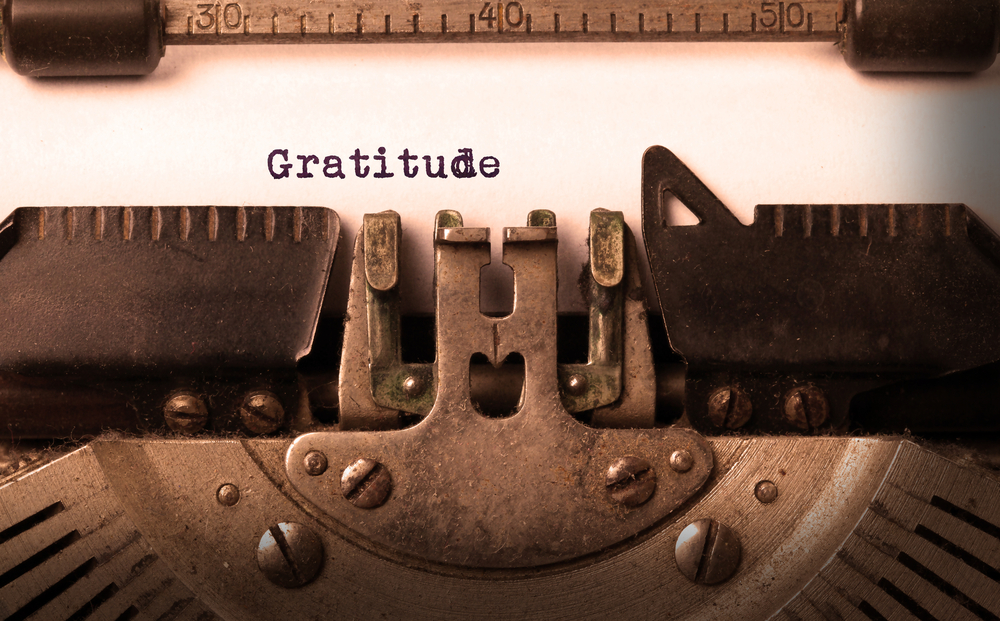 The word gratitude being typed with a typewriter