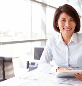 MIddle aged woman at work in office