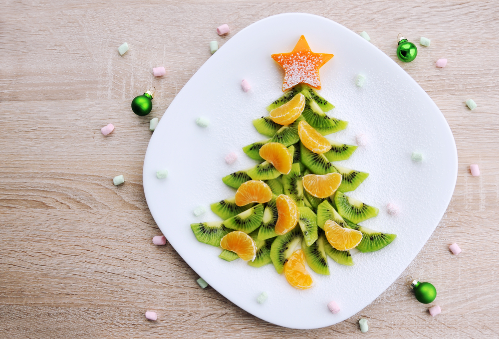 Christmas tree made out of kiwi fruit and satsuma segments