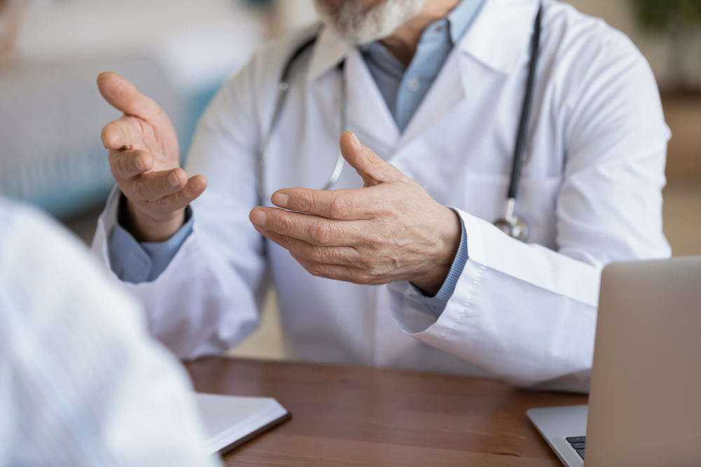 Close up of doctor talking with a patient