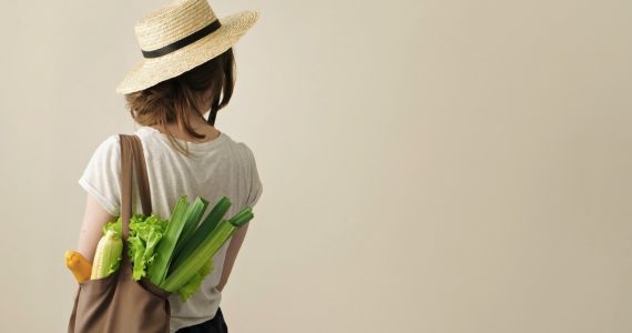 Woman with shopping bag of local produce