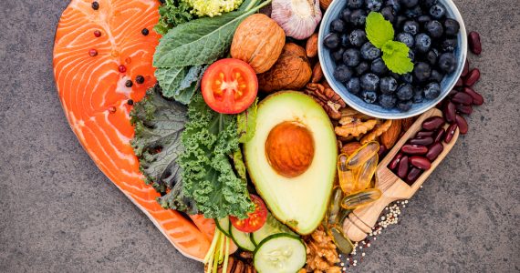 A group of heart healthy foods in a heart shape