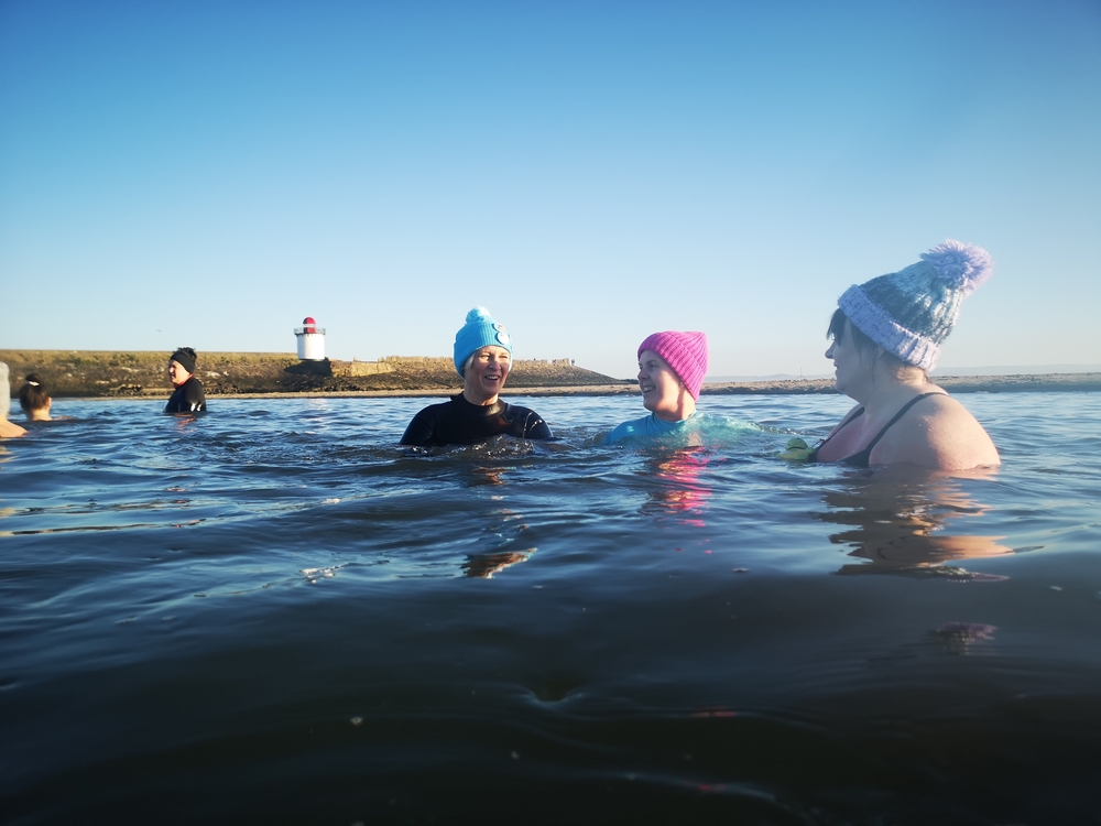 A gourp of women doing wild swimming