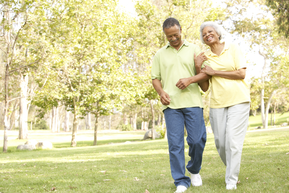 Older couple walking in a park