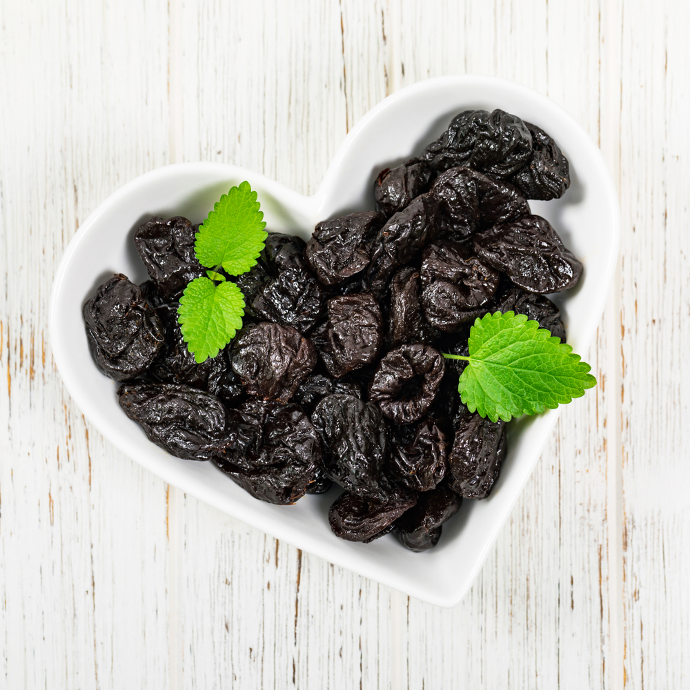 Prunes in a heart-shaped bowl